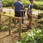 Children involved in building their first bamboo compost area (ENP)